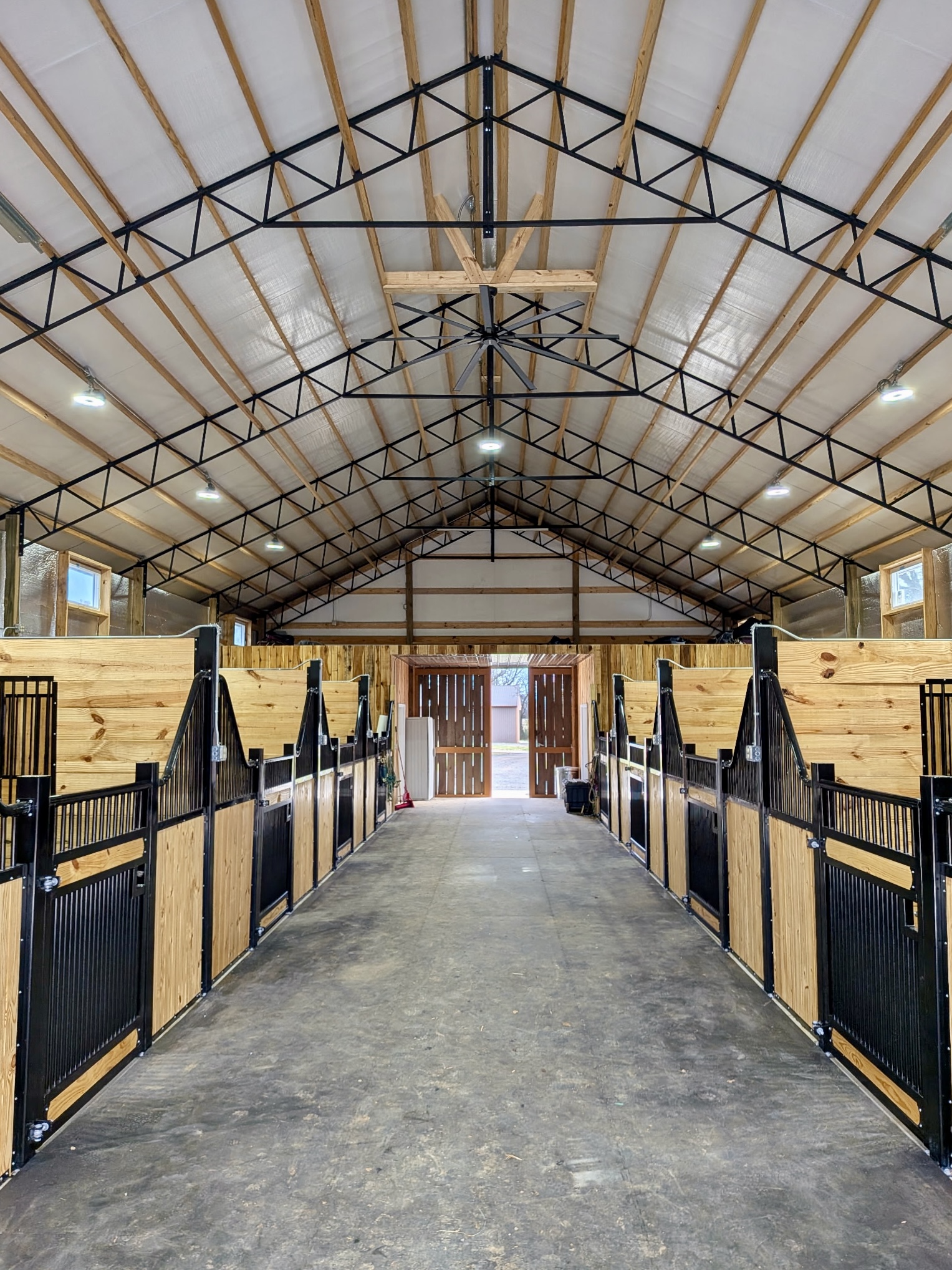 Horse barn stall aisle interior