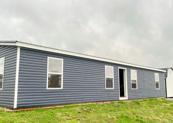 rainy day with 24x50 doublewide tiny house shell