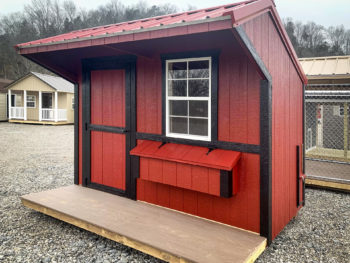 A small chicken house for sale in Kentucky with wooden siding