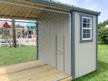 An outdoor dog kennel for sale in Tennessee with a chain link dog run