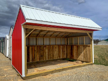 A red metal horse run-in shed sold in Kentucky