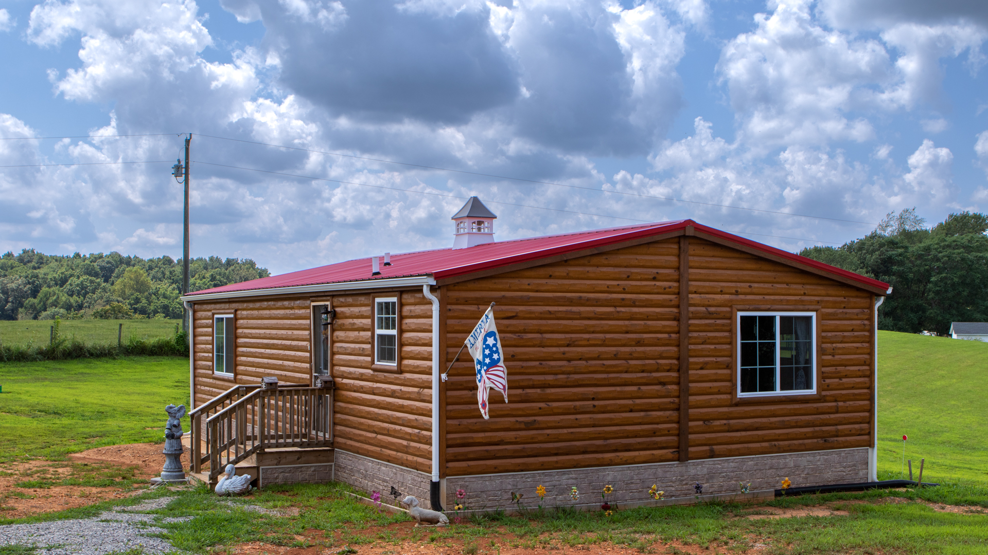 exterior of cabin home for sale on cloudy day article