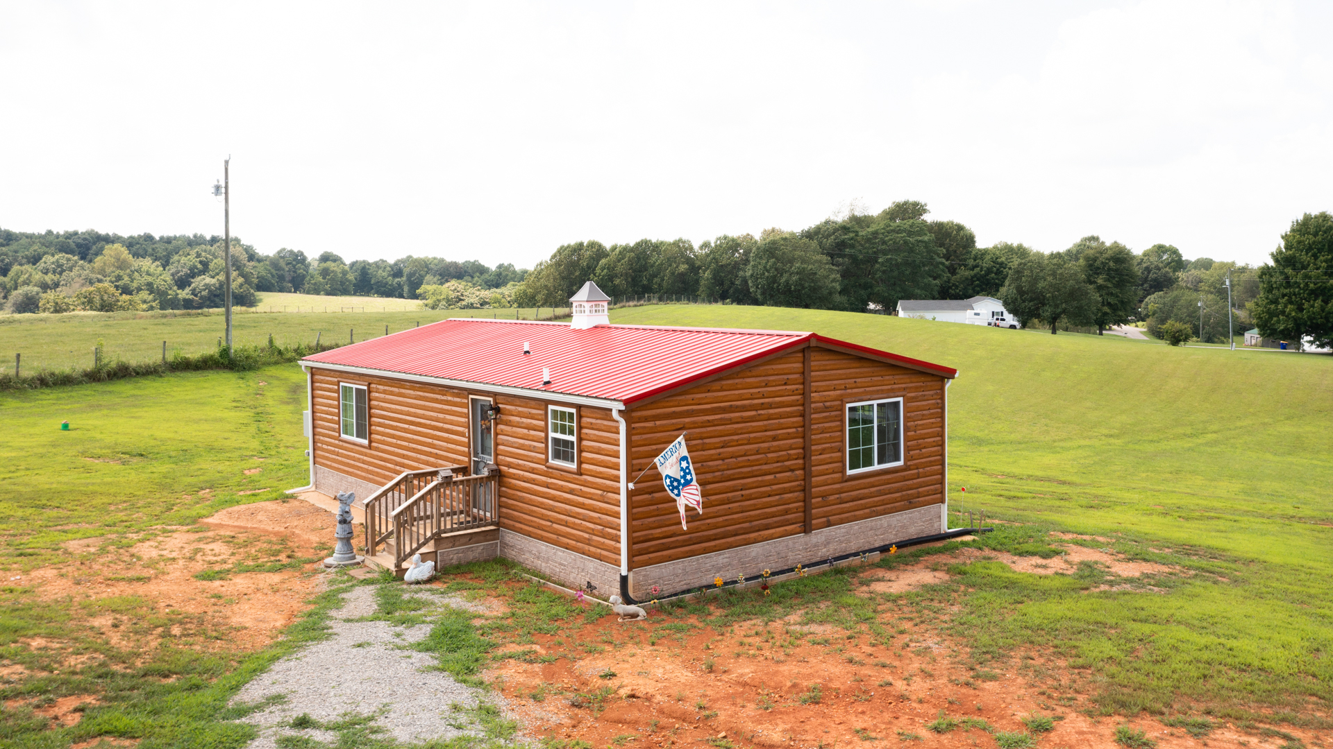 exterior of doublewide cabin home for sale for deborah whitlaw customer story