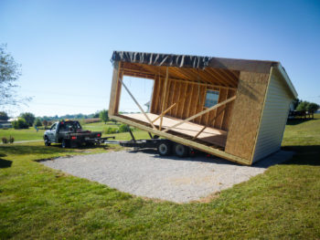 A modular garage in Kentucky being set on a gravel foundation