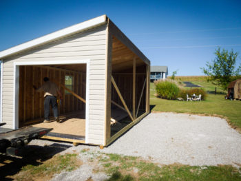 A modular garage with vinyl siding being delivered in Kentucky