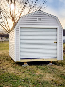 A prefab garage in Kentucky with a roll-up door and a loft