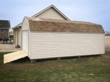 A prefab garage in Tennessee with vinyl siding and a loft