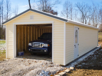 A portable garage in Kentucky with vinyl siding and a metal roof