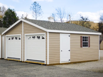 A multiple-car prebuilt garage in Kentucky with vinyl siding