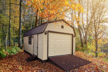 A custom prebuilt garage in Tennessee with brown vinyl siding and a loft