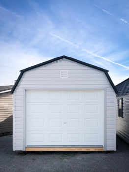 A prebuilt garage in Tennessee with white vinyl siding and a loft