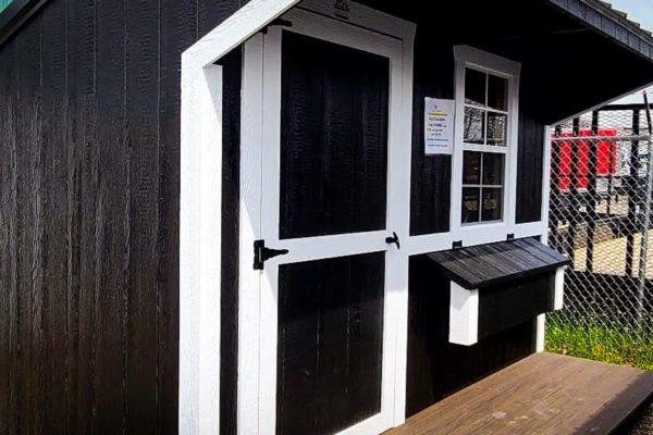 black shed painted wood siding