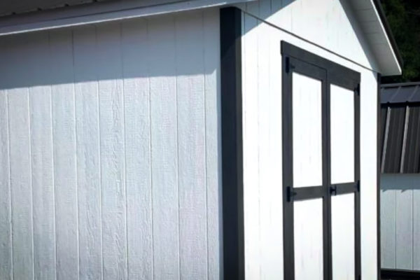 white shed painted wood siding