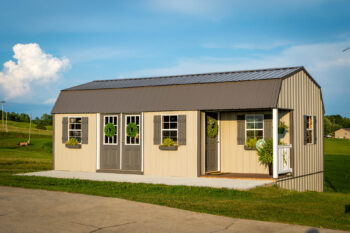 A metal shed decorated with greenery.