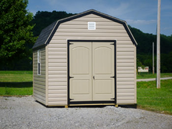 A storage building in Kentucky with vinyl siding and a loft