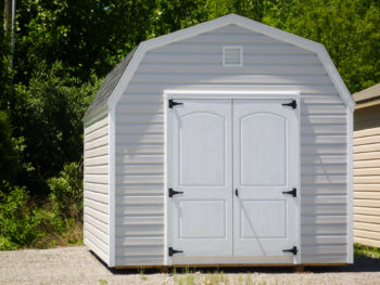 A storage building with a loft in Kentucky with vinyl siding and double doors