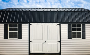 A storage building in Tennessee with a black metal roof