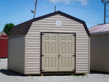 A storage building in Tennessee with vinyl siding and double doors