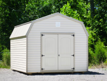 A storage building in Tennessee with vinyl siding and a loft