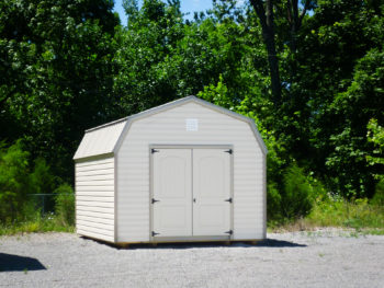 A lofted storage building in Tennessee with vinyl siding and double doors