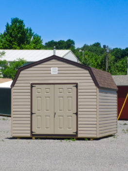 A prefab storage building in Tennessee with vinyl siding and a loft