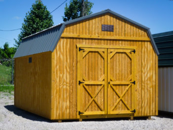 A storage building in Tennessee with wood siding and a metal roof