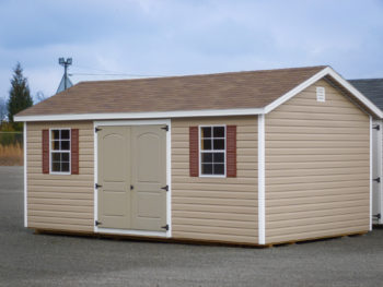 A shed in Kentucky with vinyl siding, windows, and a shingle roof