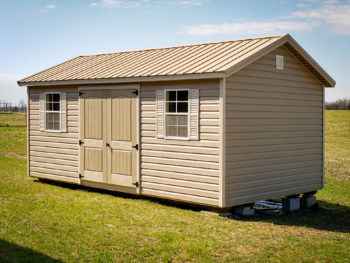 A shed in Kentucky with vinyl siding and a metal roof