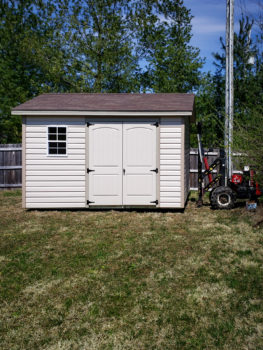 A vinyl shed being delivered in Kentucky with double doors and windows