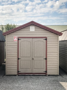 A discounted shed in Tennessee with vinyl siding and a metal roof