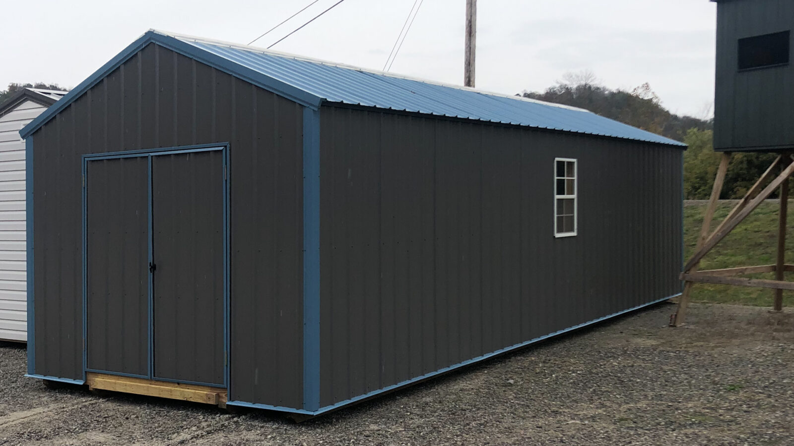 exterior of black and blue ranch metal shed for sale in KY and TN