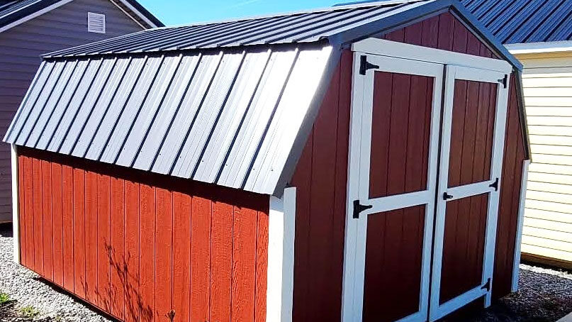 exterior of amazing red and white low barn painted wood shed for sale in KY and TN