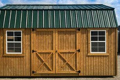 green-roofed barn with stained wood shed siding option