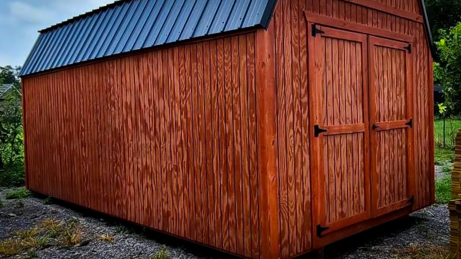 red shed stained wood siding
