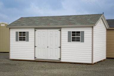 A shed in Kentucky with vinyl siding and vinyl double doors