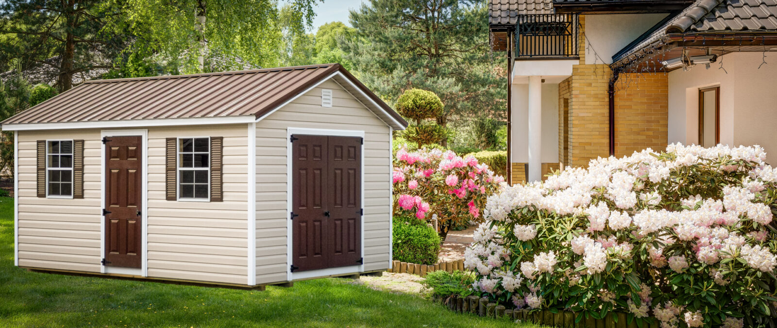 A shed in Tennessee with vinyl siding and a brown metal roof