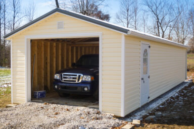 A portable garage in Kentucky with vinyl siding and a metal roof
