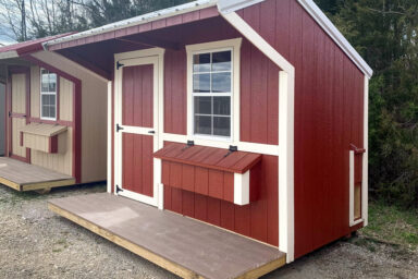 A red backyard chicken house for sale in Tennessee with a porch