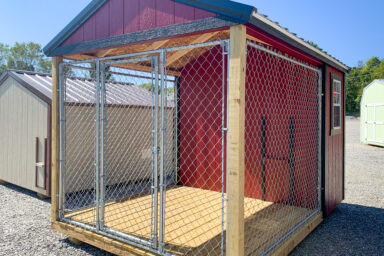 A red prefab dog kennel for sale in Tennessee