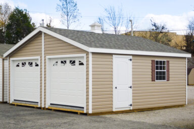 A multiple-car prebuilt garage in Kentucky with vinyl siding