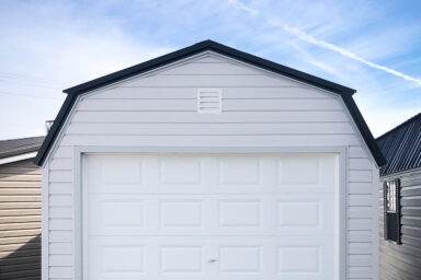 A prebuilt garage in Tennessee with white vinyl siding and a loft