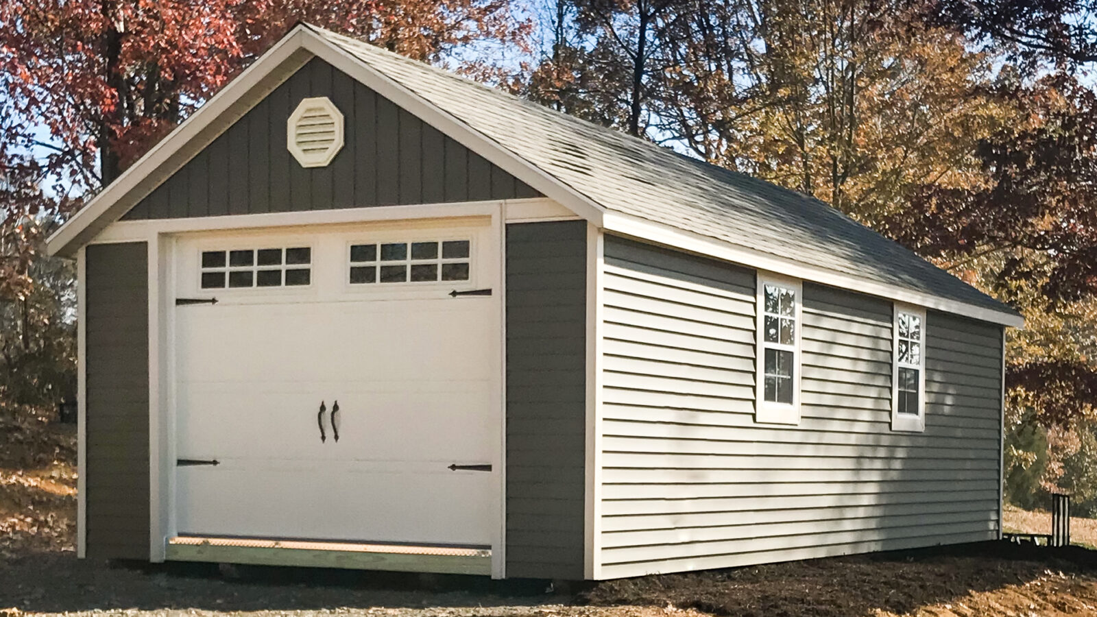 exterior of green garage shed in the forest for sale