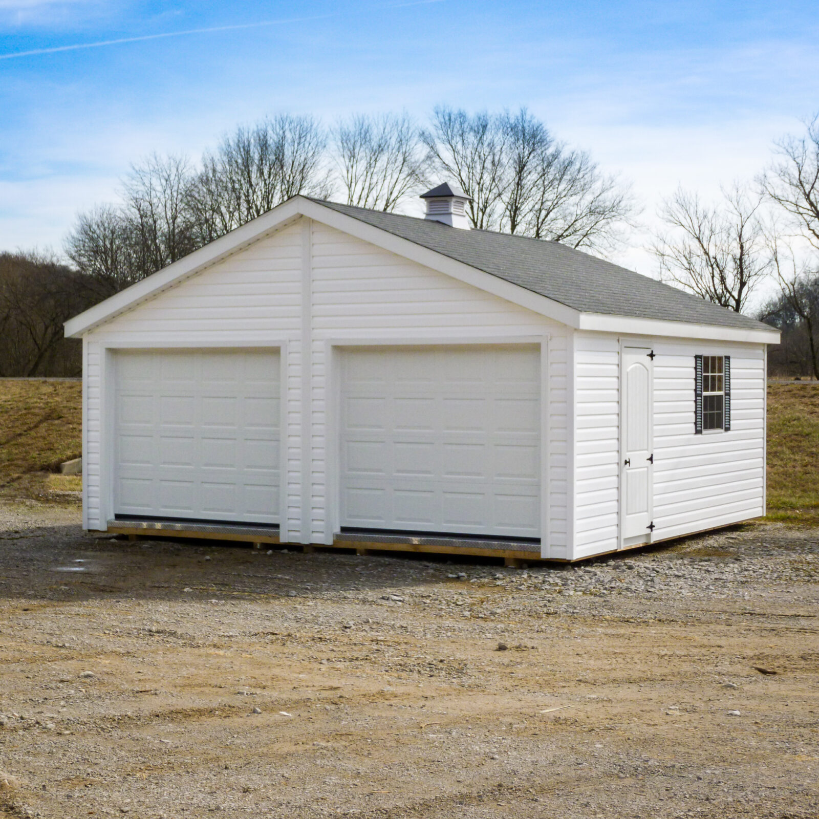 exterior of white multiple car garage for garage sheds article